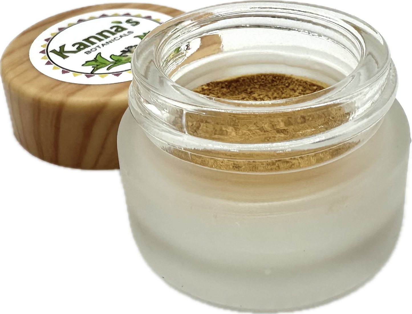 Small opaque glass 1g Jar with clear top edge containing tannish orange Kanna Full Spectrum Extract Powder in front of a wooden lid with Kanna's Botanicals logo sticker on top. 
Product: Kanna Full Spectrum Extract Powder (1g jar). 
- Kanna's Botanicals LLC